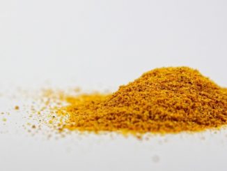 turmeric powder on white surface